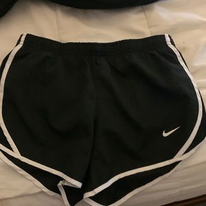 Black Nike athletic shorts.